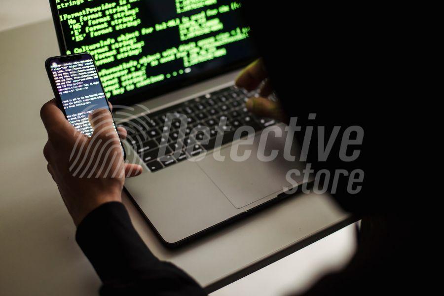 A forensic specialist analyzes digital data on a smartphone and laptop, showcasing advanced data recovery and cybersecurity investigation techniques.