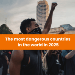 A protester raising a fist during a demonstration, symbolizing unrest, with a caption highlighting the most dangerous countries in 2025