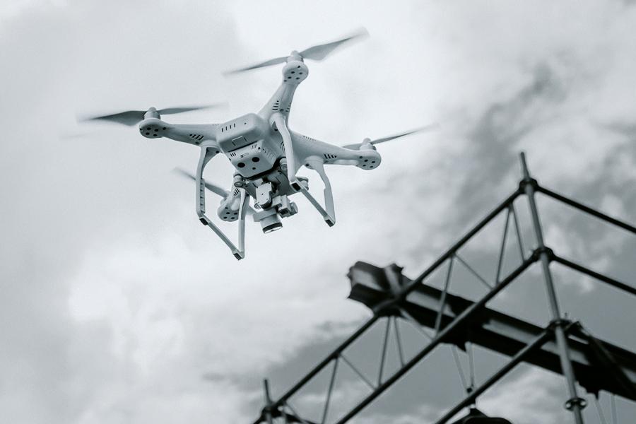 A military drone in flight, illustrating how unencrypted satellite links have been exploited for signal interception in real-world surveillance operations.